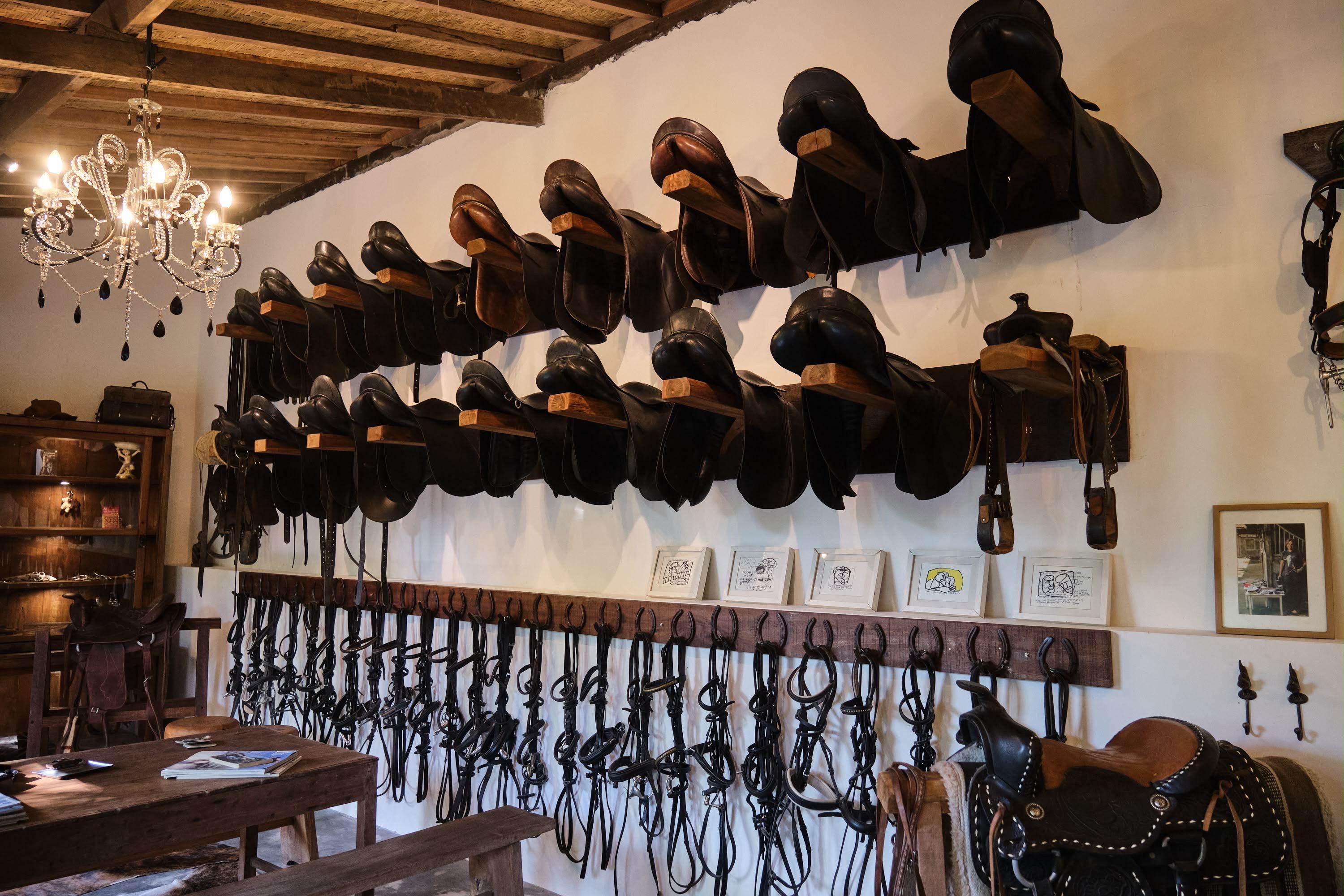 Western saddle and tack on display in the stable photoshoot